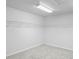 Walk-in closet featuring white wire shelving and a neutral carpet at 7412 Bridgeview Dr, Wesley Chapel, FL 33545