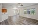 Open dining area featuring wood flooring, chandelier, and sliding glass doors to the patio at 7412 Bridgeview Dr, Wesley Chapel, FL 33545