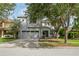 Charming two-story home featuring a two-car garage and mature landscaping at 7412 Bridgeview Dr, Wesley Chapel, FL 33545