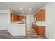 Kitchen featuring wood cabinets, stainless steel appliances, and a breakfast bar at 7412 Bridgeview Dr, Wesley Chapel, FL 33545