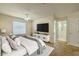 This main bedroom features a ceiling fan, a closet, and an en suite bathroom at 7852 Stoney Hill Dr, Wesley Chapel, FL 33545