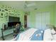Unique bedroom features gaming decor, modern lighting, and a comfortable bed, perfect for relaxing and gaming at 7852 Stoney Hill Dr, Wesley Chapel, FL 33545
