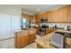 Functional kitchen with stainless steel appliances, an island, and plenty of cabinet space for storage at 7852 Stoney Hill Dr, Wesley Chapel, FL 33545