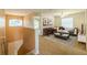 Upstairs living room with neutral walls, plush seating, and modern decor, creating a welcoming space at 7852 Stoney Hill Dr, Wesley Chapel, FL 33545