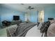 Luxurious main bedroom featuring comfortable seating and access to the en-suite bathroom at 7852 Stoney Hill Dr, Wesley Chapel, FL 33545