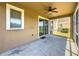 Covered patio with fan and sliding glass doors at 7852 Stoney Hill Dr, Wesley Chapel, FL 33545