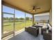 Spacious screened-in patio with comfortable seating and scenic views at 7852 Stoney Hill Dr, Wesley Chapel, FL 33545