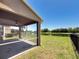 This screened patio overlooks a pond, and a green lawn on a sunny day at 7852 Stoney Hill Dr, Wesley Chapel, FL 33545