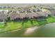 Aerial view featuring backyard lawn leading to lake at 7912 Yale Harbor Dr, Wesley Chapel, FL 33545