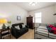 Small bonus bedroom featuring a twin bed, couch, wardrobe, and decorative accents at 7912 Yale Harbor Dr, Wesley Chapel, FL 33545