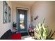 Cozy front porch featuring a decorative glass door and neutral wall decor at 7912 Yale Harbor Dr, Wesley Chapel, FL 33545
