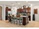 Spacious kitchen island featuring granite countertops and modern stainless steel appliances at 7912 Yale Harbor Dr, Wesley Chapel, FL 33545
