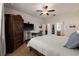 Spacious main bedroom with tile floors, ceiling fan, and en-suite bathroom access at 7912 Yale Harbor Dr, Wesley Chapel, FL 33545