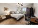 Inviting main bedroom with tile flooring, a large window, and a comfortable bed at 7912 Yale Harbor Dr, Wesley Chapel, FL 33545