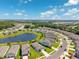 Panoramic aerial view showcasing a vibrant community surrounding a beautiful pond at 8496 Starlight Loop, Parrish, FL 34219