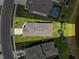 Aerial view showcases the home's layout, large backyard, pool access, landscaping, and proximity to the surrounding neighborhood at 8496 Starlight Loop, Parrish, FL 34219