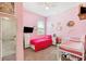 Bedroom with a bed and crib, side tables, and a dresser at 8496 Starlight Loop, Parrish, FL 34219