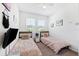 Cozy bedroom featuring two twin beds, plush pillows and neutral paint at 8496 Starlight Loop, Parrish, FL 34219