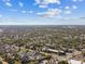 Broad aerial shot of the community exhibits its layout, green spaces, and residential character under a partly cloudy sky at 1020 38Th N Ave, St Petersburg, FL 33704