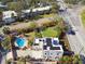 Stunning aerial view of the property featuring a beautiful pool, lush landscaping, and a well-maintained yard at 1020 38Th N Ave, St Petersburg, FL 33704