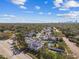 An aerial view showcasing the property, its lush landscaping, and the nearby cityscape at 1020 38Th N Ave, St Petersburg, FL 33704