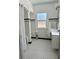 Bright bathroom with black and white tile, and a shower with a rain shower head at 1020 38Th N Ave, St Petersburg, FL 33704