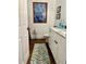 Stylish bathroom featuring modern vanity with marble countertop, decorative mirror, and accent rug at 1020 38Th N Ave, St Petersburg, FL 33704