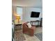 Comfortable bedroom featuring accent chair, area rug, and mounted television at 1020 38Th N Ave, St Petersburg, FL 33704