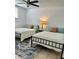 Bedroom with two twin beds featuring patterned pillows and a blue patterned area rug at 1020 38Th N Ave, St Petersburg, FL 33704