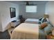 This bedroom features two twin beds, a ceiling fan and a window with blinds at 1020 38Th N Ave, St Petersburg, FL 33704