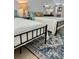 Bedroom featuring two twin beds with an accent rug and a lamp on the nightstand at 1020 38Th N Ave, St Petersburg, FL 33704