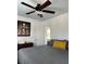 Bedroom with ceiling fan, stained glass window, and gray bedding at 1020 38Th N Ave, St Petersburg, FL 33704
