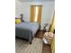 Comfortable bedroom with a striking color scheme, wood floors, and a sitting nook at 1020 38Th N Ave, St Petersburg, FL 33704