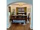 Inviting dining room with a sturdy wooden table and olive green curtains enhancing the ambiance at 1020 38Th N Ave, St Petersburg, FL 33704