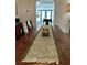 Rustic dining room with a long wooden table and view of the kitchen through an arched doorway at 1020 38Th N Ave, St Petersburg, FL 33704