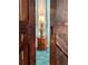 Cozy entryway featuring a vintage lamp atop a decorative wooden table, framed by rustic barn doors at 1020 38Th N Ave, St Petersburg, FL 33704