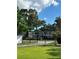 Apartment complex behind gated entry and large shade trees at 1020 38Th N Ave, St Petersburg, FL 33704