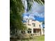 Charming stucco home with red tile roof and lush landscaping, creating a cozy and inviting curb appeal at 1020 38Th N Ave, St Petersburg, FL 33704