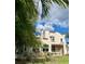 Charming stucco home with red tile roof and lush landscaping, creating a cozy and inviting curb appeal at 1020 38Th N Ave, St Petersburg, FL 33704