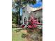 A partial view of the stucco home showcasing the unique stucco patterns and vibrant landscaping at 1020 38Th N Ave, St Petersburg, FL 33704