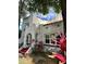 Stucco home featuring red steps leading to an arched entrance with a charming teal door at 1020 38Th N Ave, St Petersburg, FL 33704