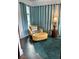 Cozy living area featuring a comfortable leather chair and ottoman with a stylish lamp at 1020 38Th N Ave, St Petersburg, FL 33704