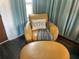 This living area features an amber colored lounge chair and stool with decorative pillow and blanket at 1020 38Th N Ave, St Petersburg, FL 33704