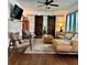 Spacious living room featuring a leather sectional, fireplace, and sliding barn doors at 1020 38Th N Ave, St Petersburg, FL 33704