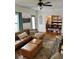 Bright living room showcasing a comfortable leather sectional and an open archway to the dining room at 1020 38Th N Ave, St Petersburg, FL 33704