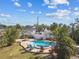 Outdoor living is easy with this gorgeous kidney-shaped pool, patio and lush landscaping at 1020 38Th N Ave, St Petersburg, FL 33704