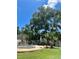 Picturesque backyard featuring a swimming pool with a patio dining area and tropical plants at 1020 38Th N Ave, St Petersburg, FL 33704
