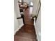 Elegant staircase leading to a living area with comfortable leather sofa at 1020 38Th N Ave, St Petersburg, FL 33704