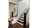 Classic staircase design with dark wood treads, white risers, and decorative accents at 1020 38Th N Ave, St Petersburg, FL 33704