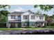 Beautiful townhouse with white siding, stone accents, and well-maintained landscaping at 10709 Wading River Ave, Parrish, FL 34219